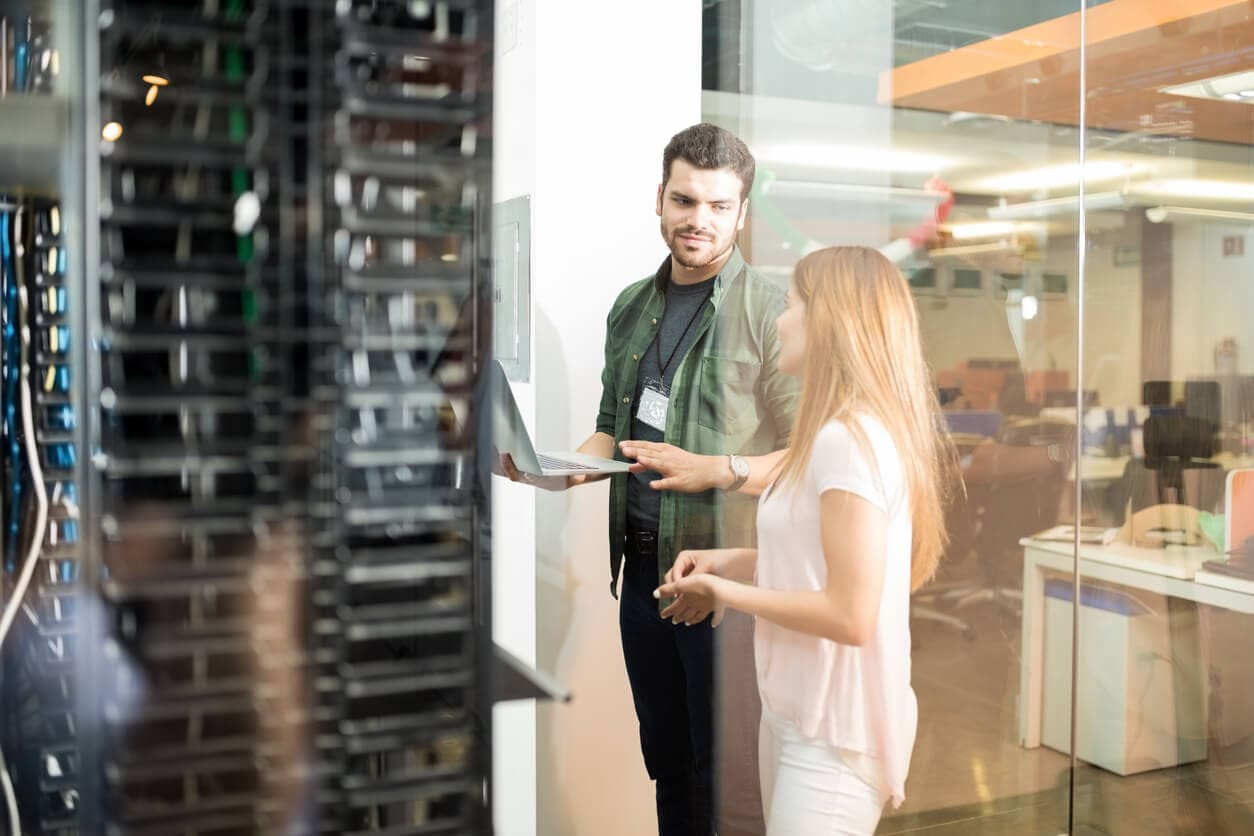 colleagues-discussing-in-office-server-room-2